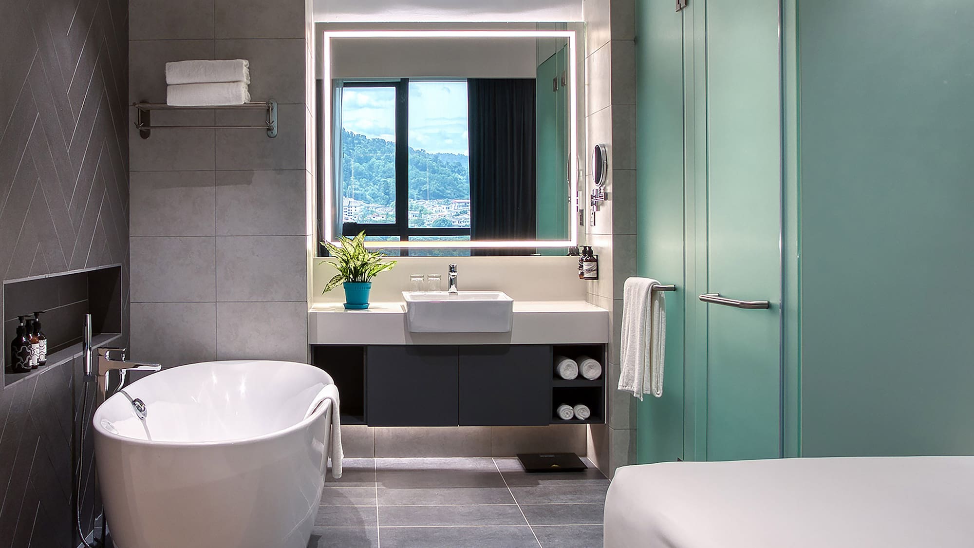 a bathroom with a tub and a sink