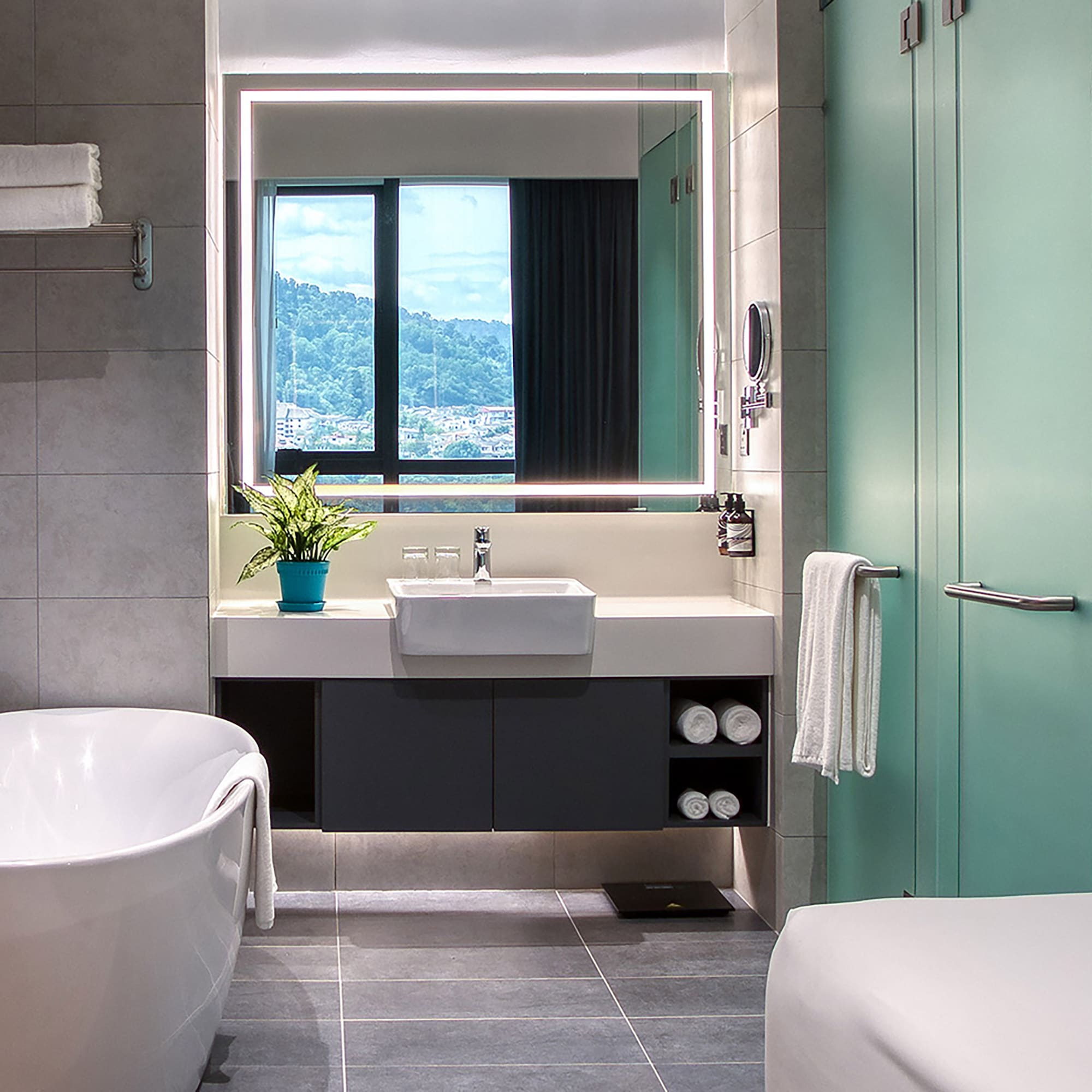 a bathroom with a tub and a sink