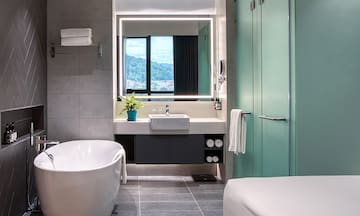 a bathroom with a tub and a sink