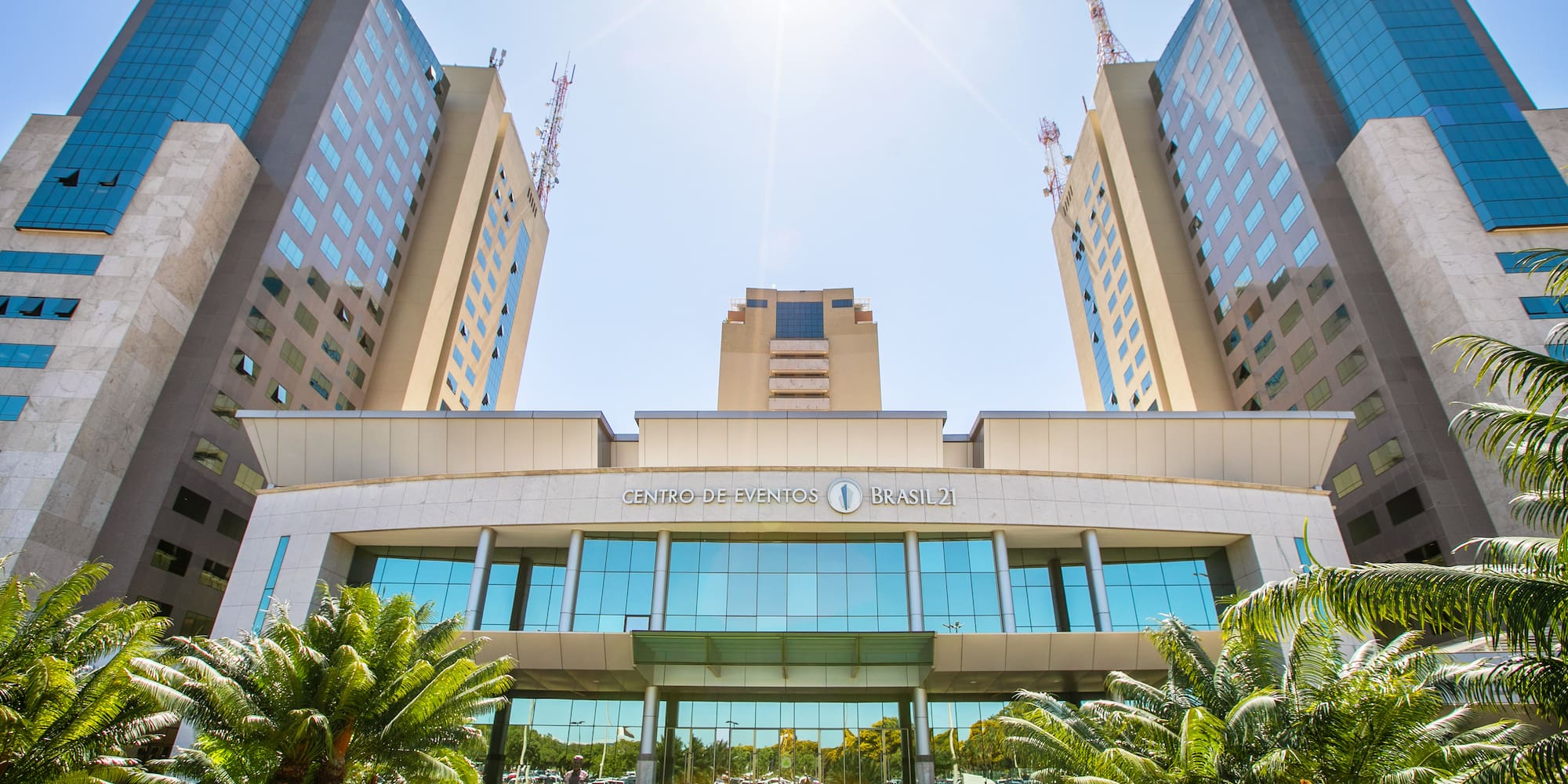a building with trees and a lawn