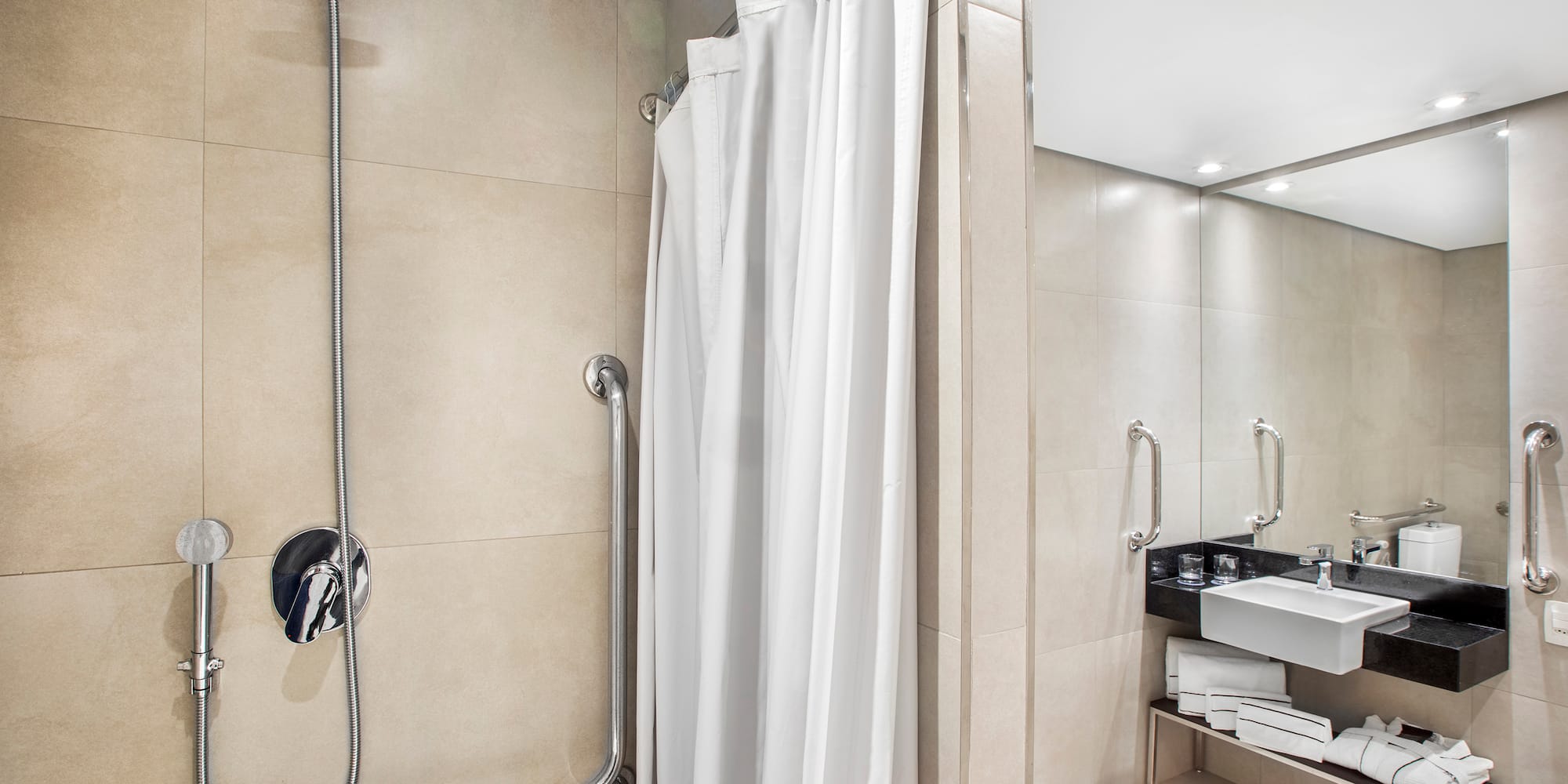 a shower with a white curtain