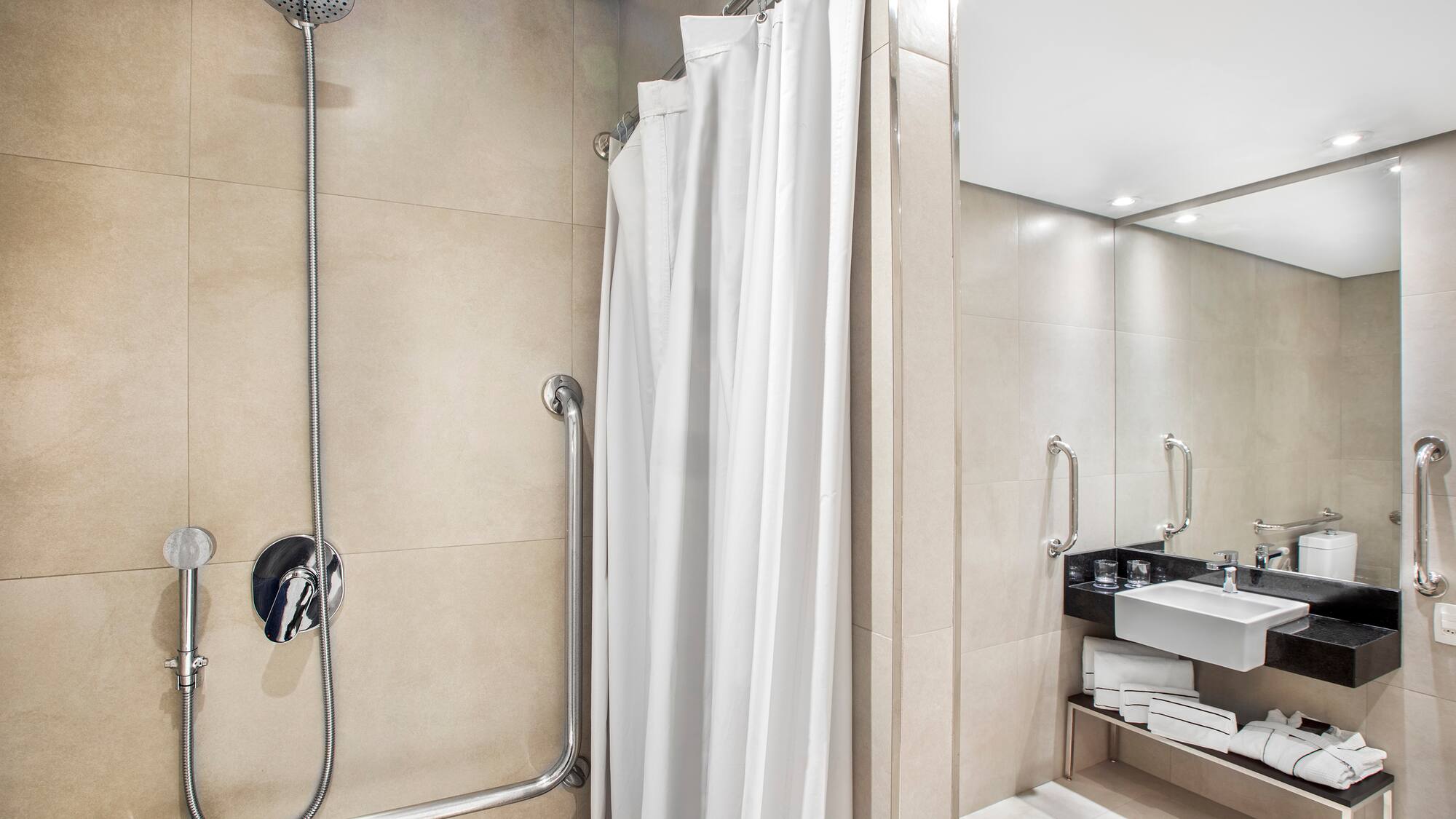 a shower with a white curtain