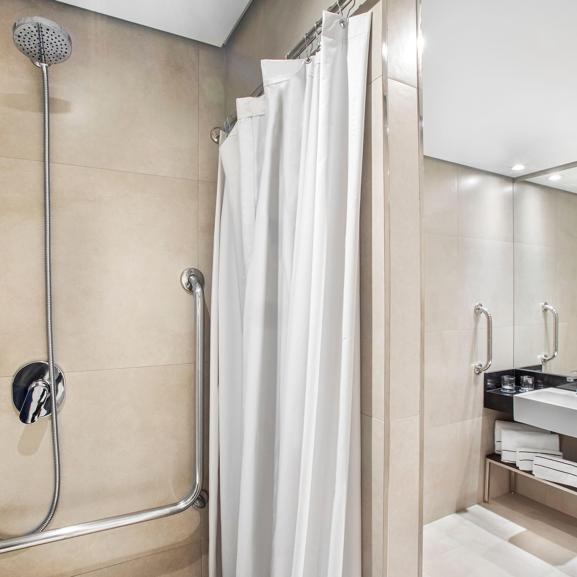 a shower with a white curtain