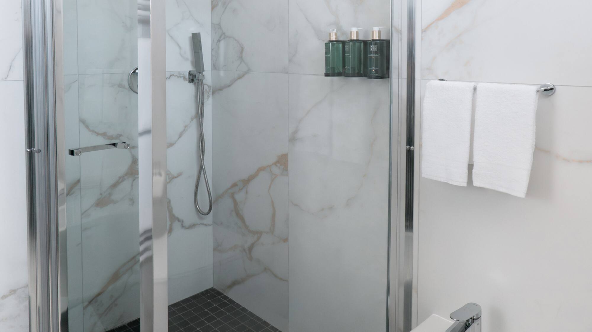 a shower and sink in a bathroom