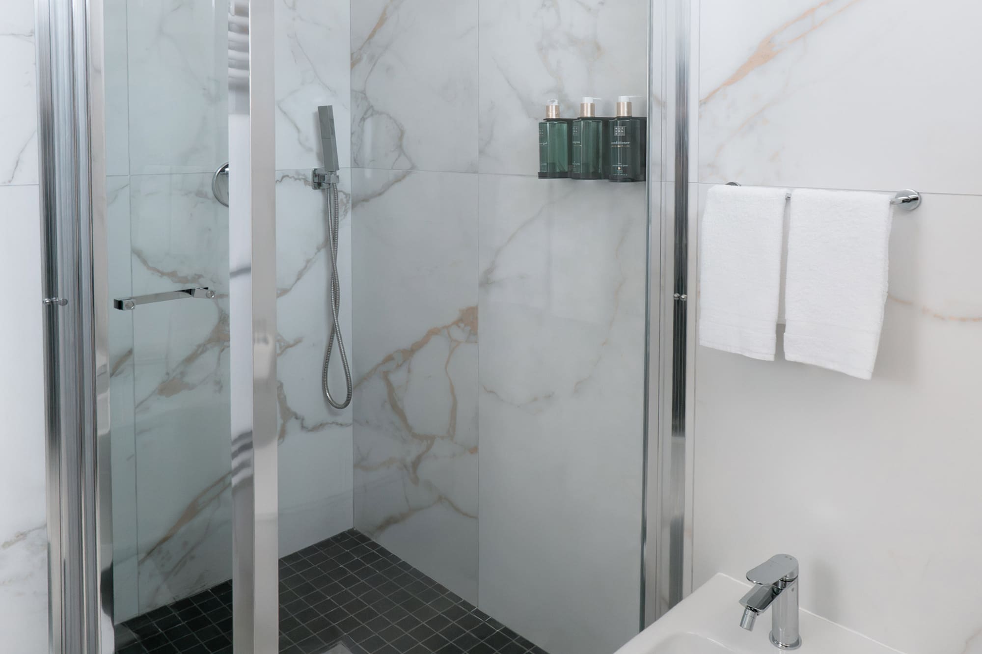 a shower and sink in a bathroom