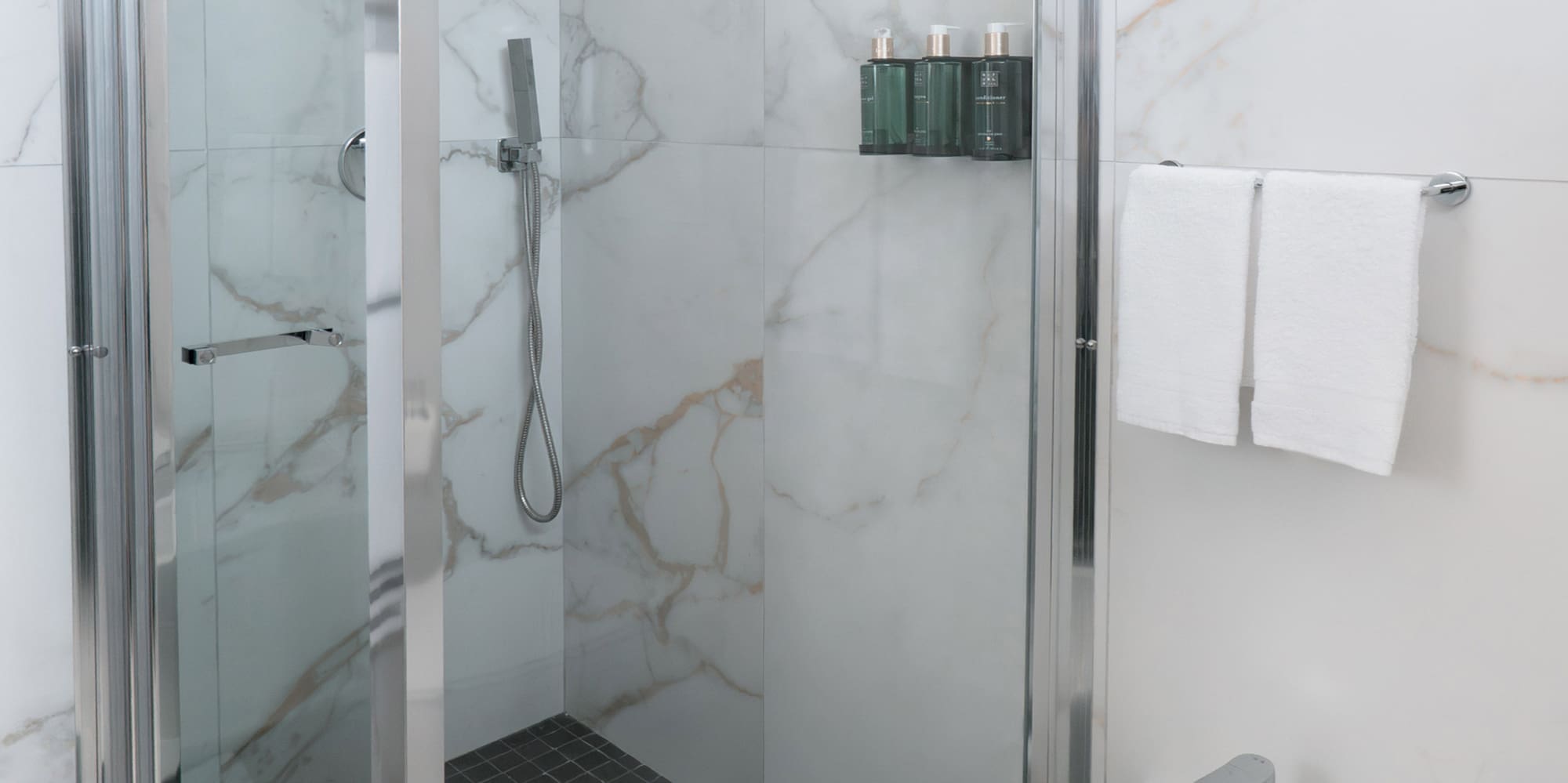 a shower and sink in a bathroom