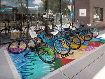a group of bicycles parked outside a building