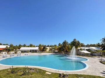 a pool with a fountain in the middle