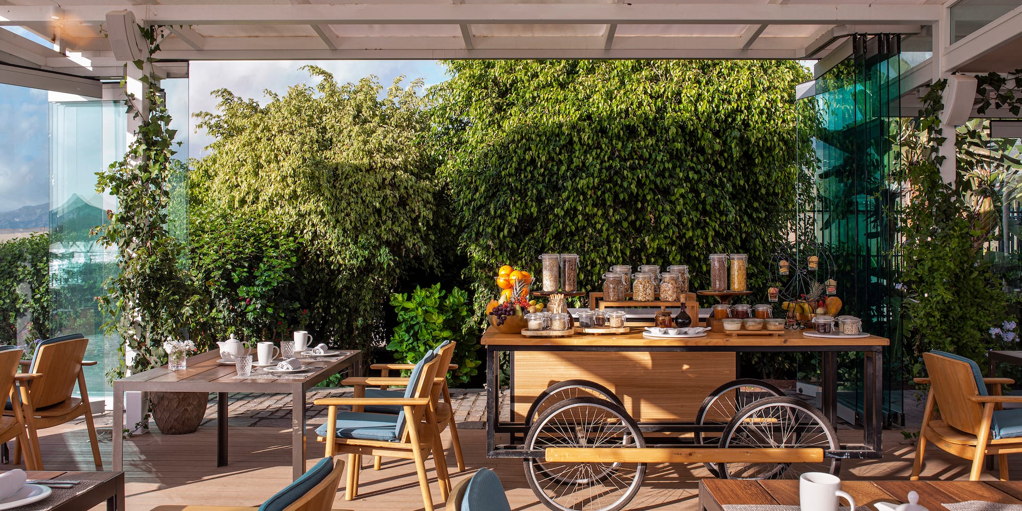 a table with food on it and chairs on a deck