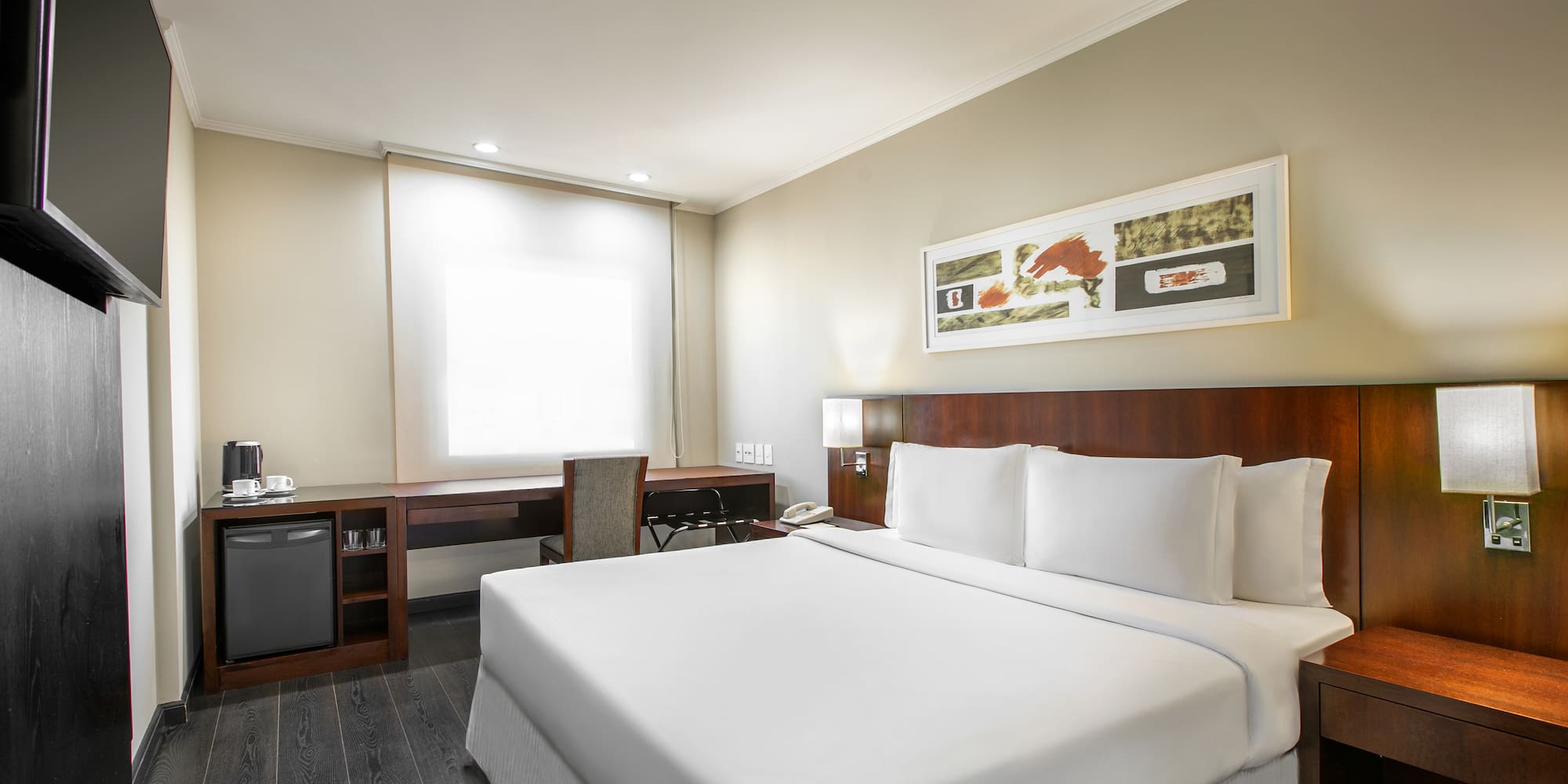 a room with a bed and a desk