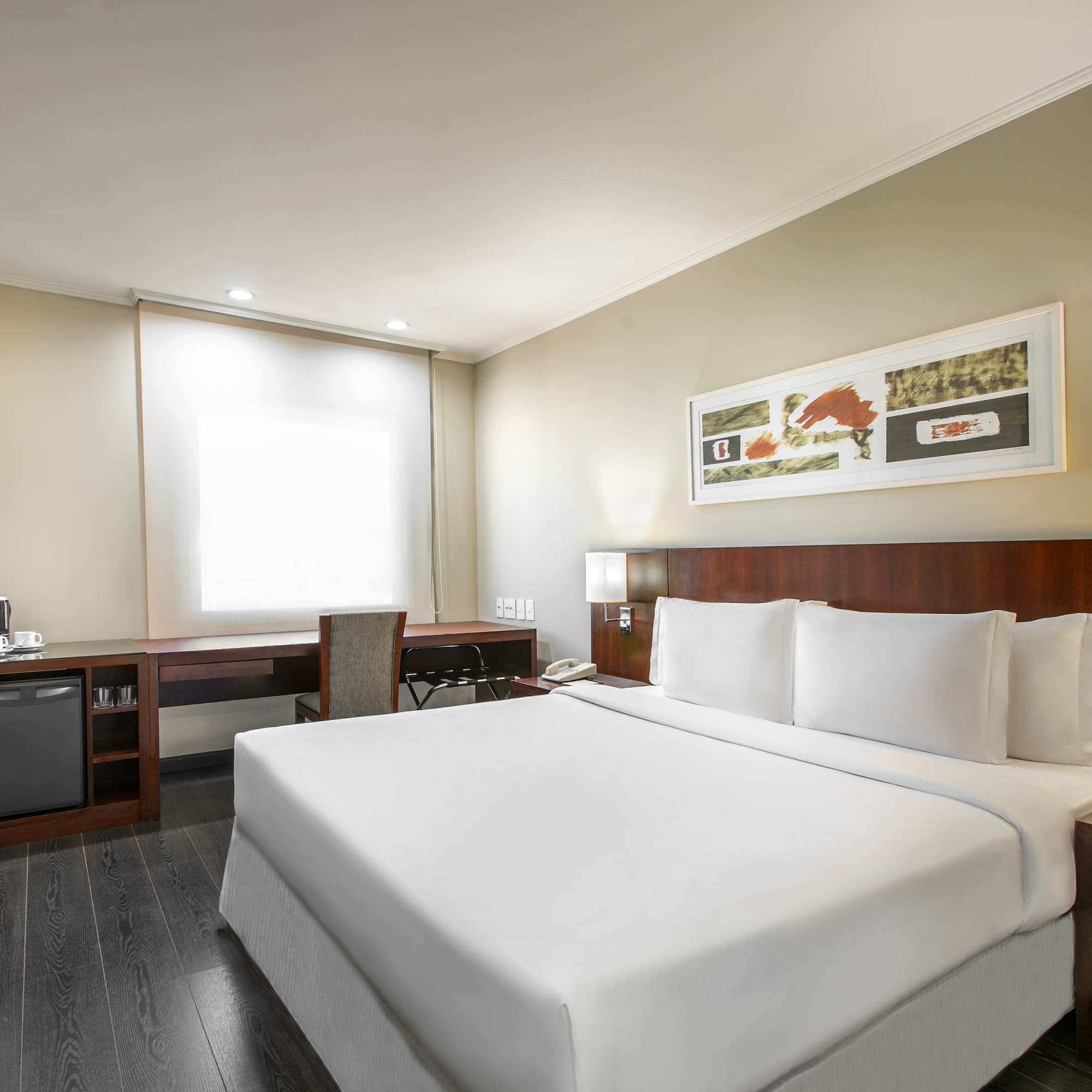 a room with a bed and a desk