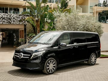a black van parked in front of a building