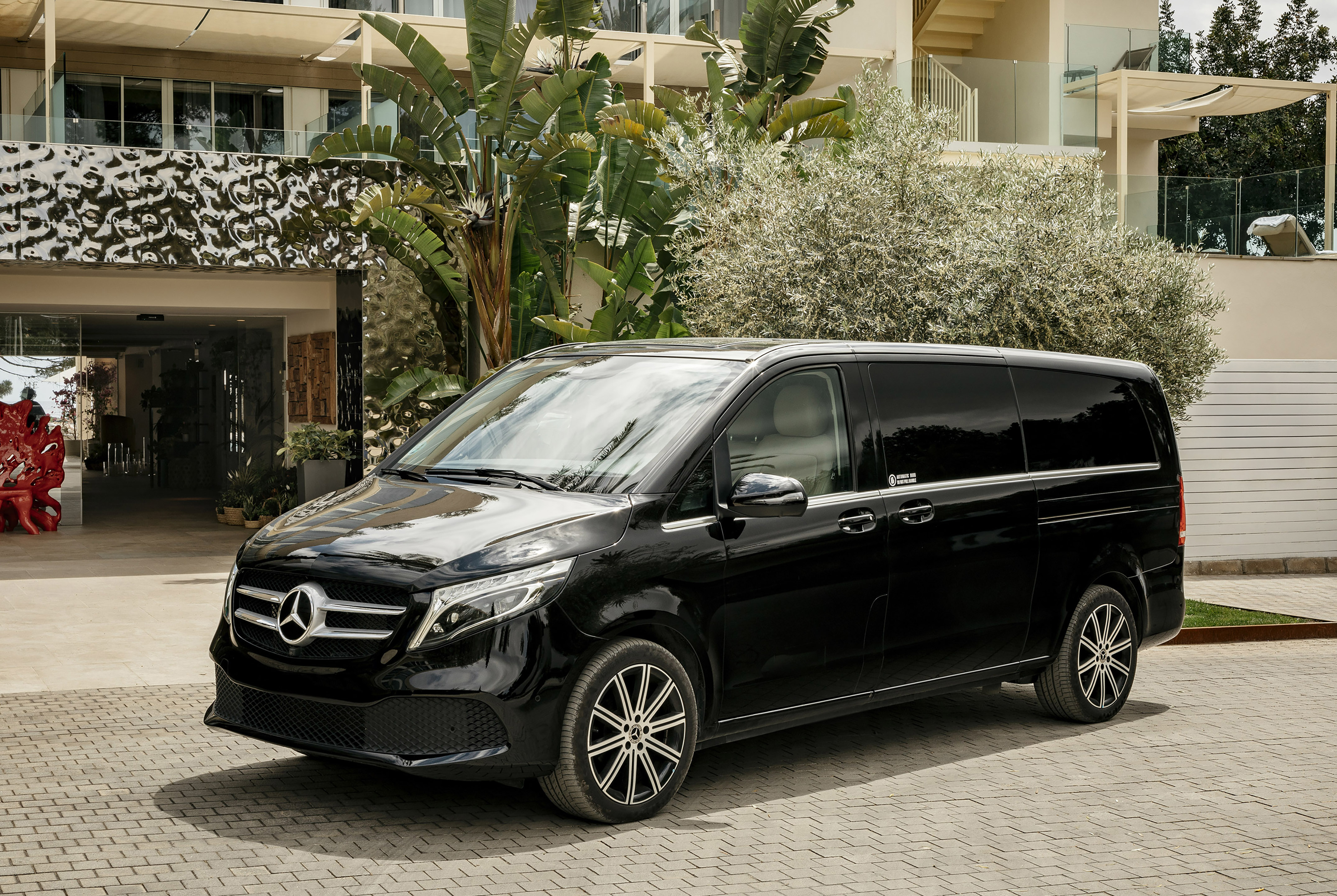 a black van parked in front of a building