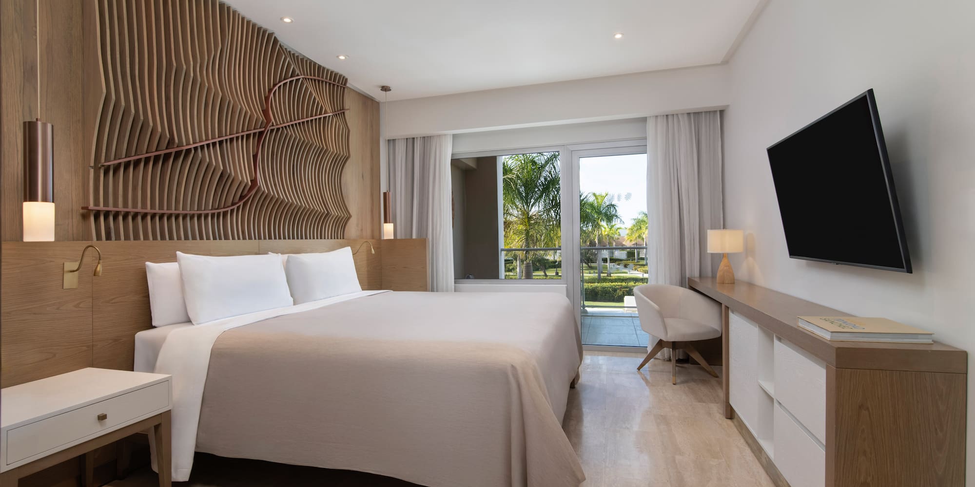 a room with a bed and a television