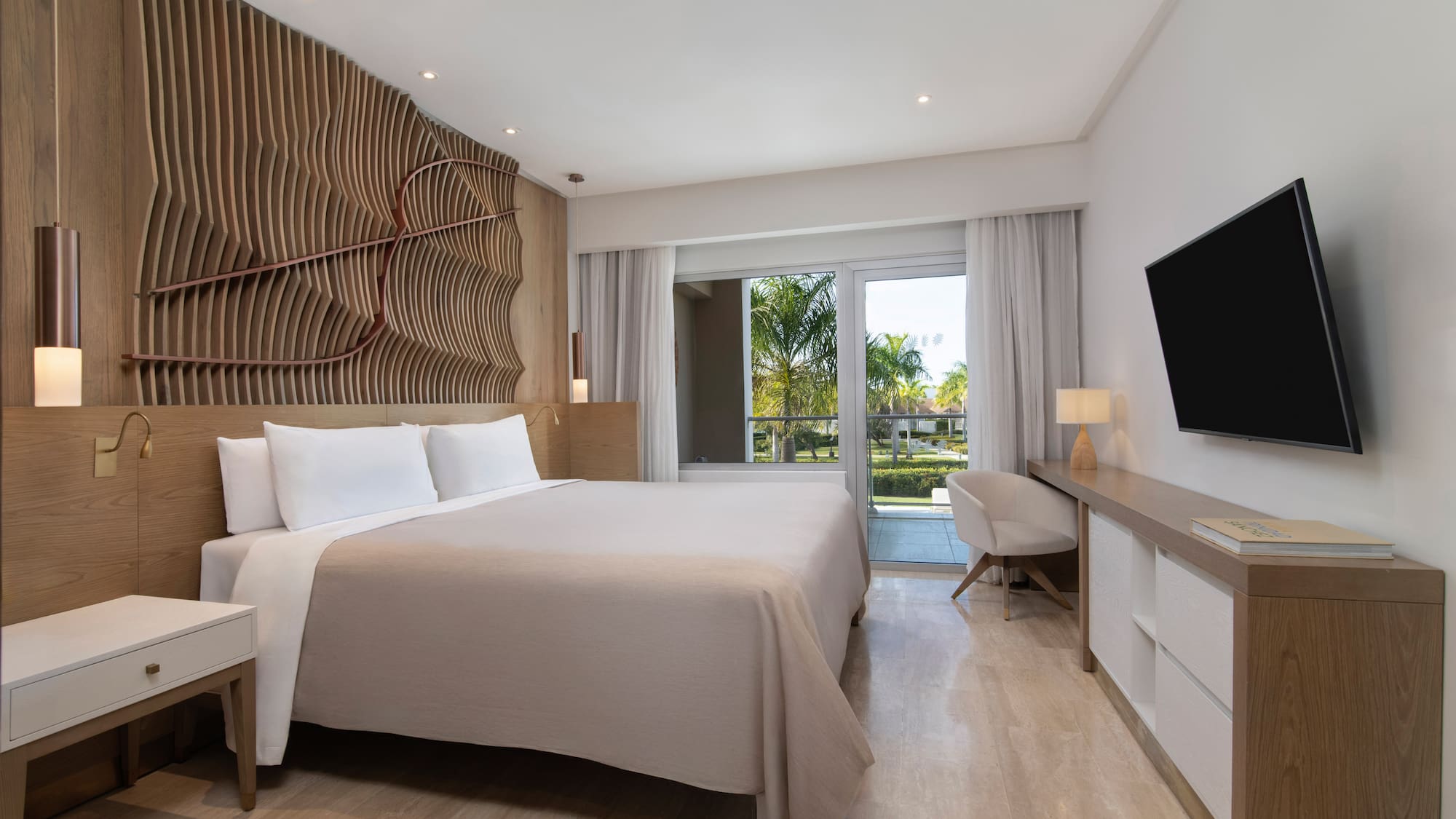 a room with a bed and a television