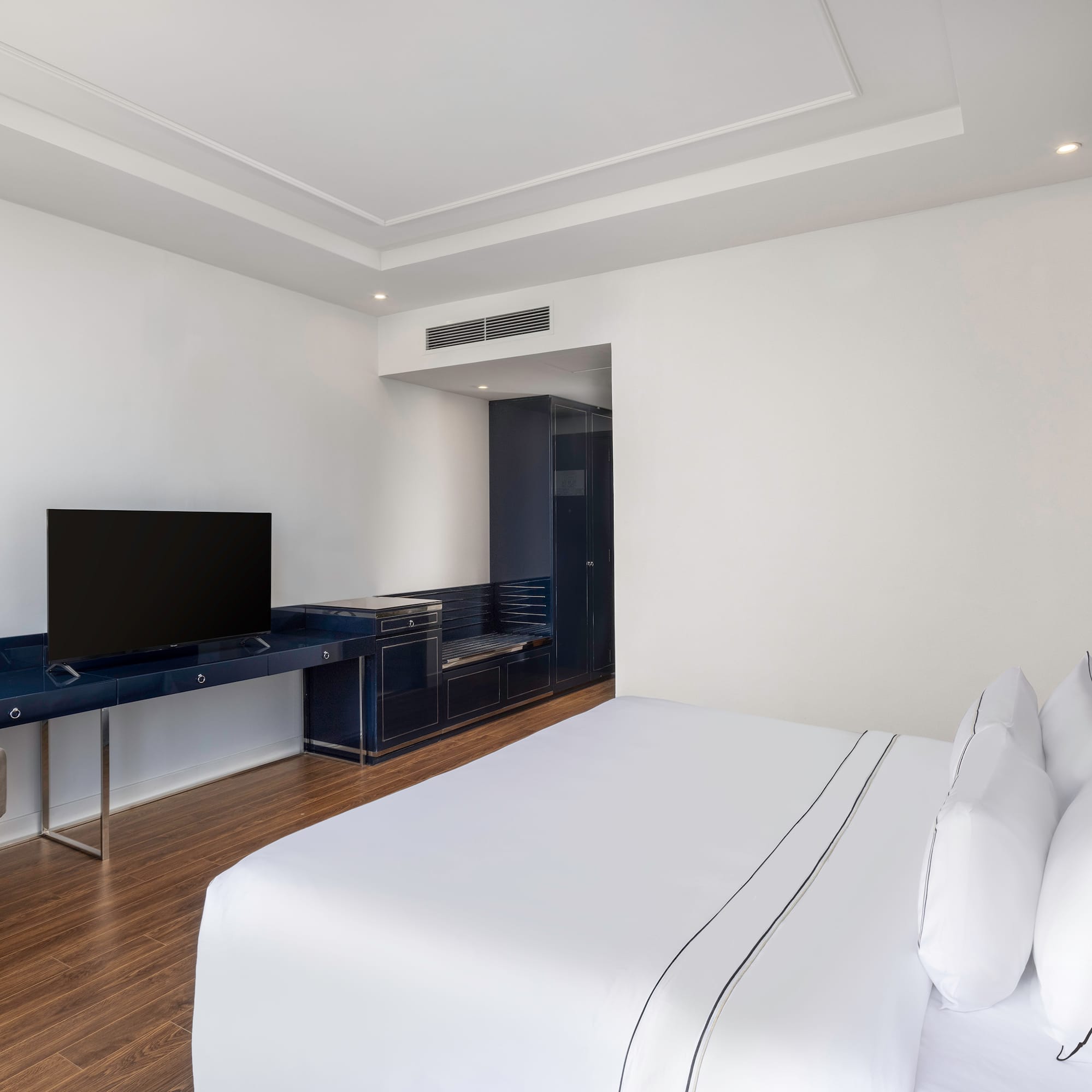 a room with a tv and a bed