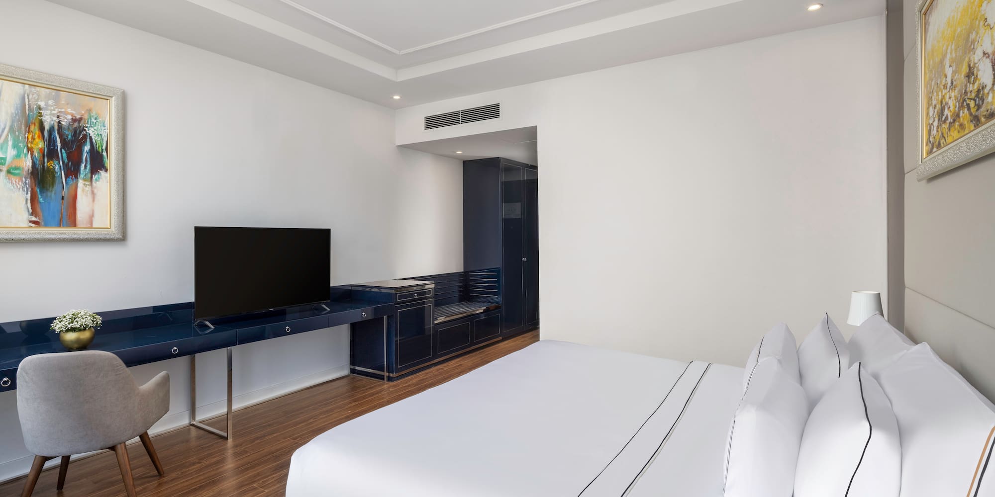 a room with a tv and a bed