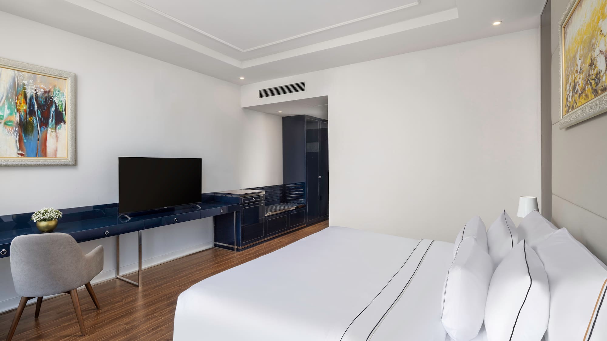 a room with a tv and a bed