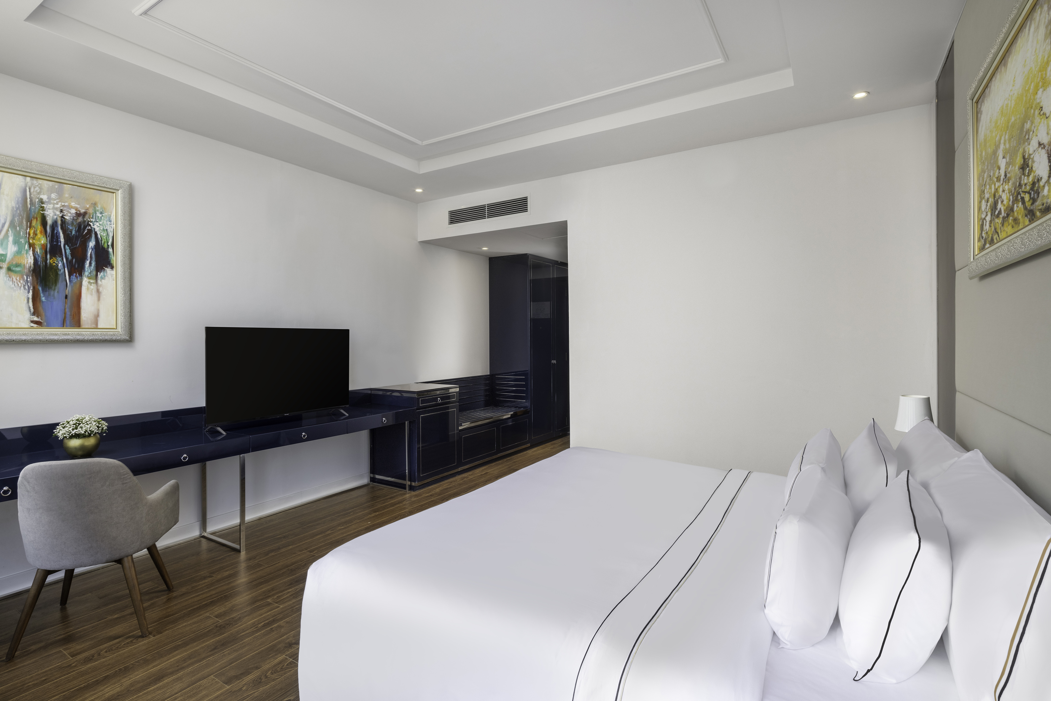 a room with a tv and a bed