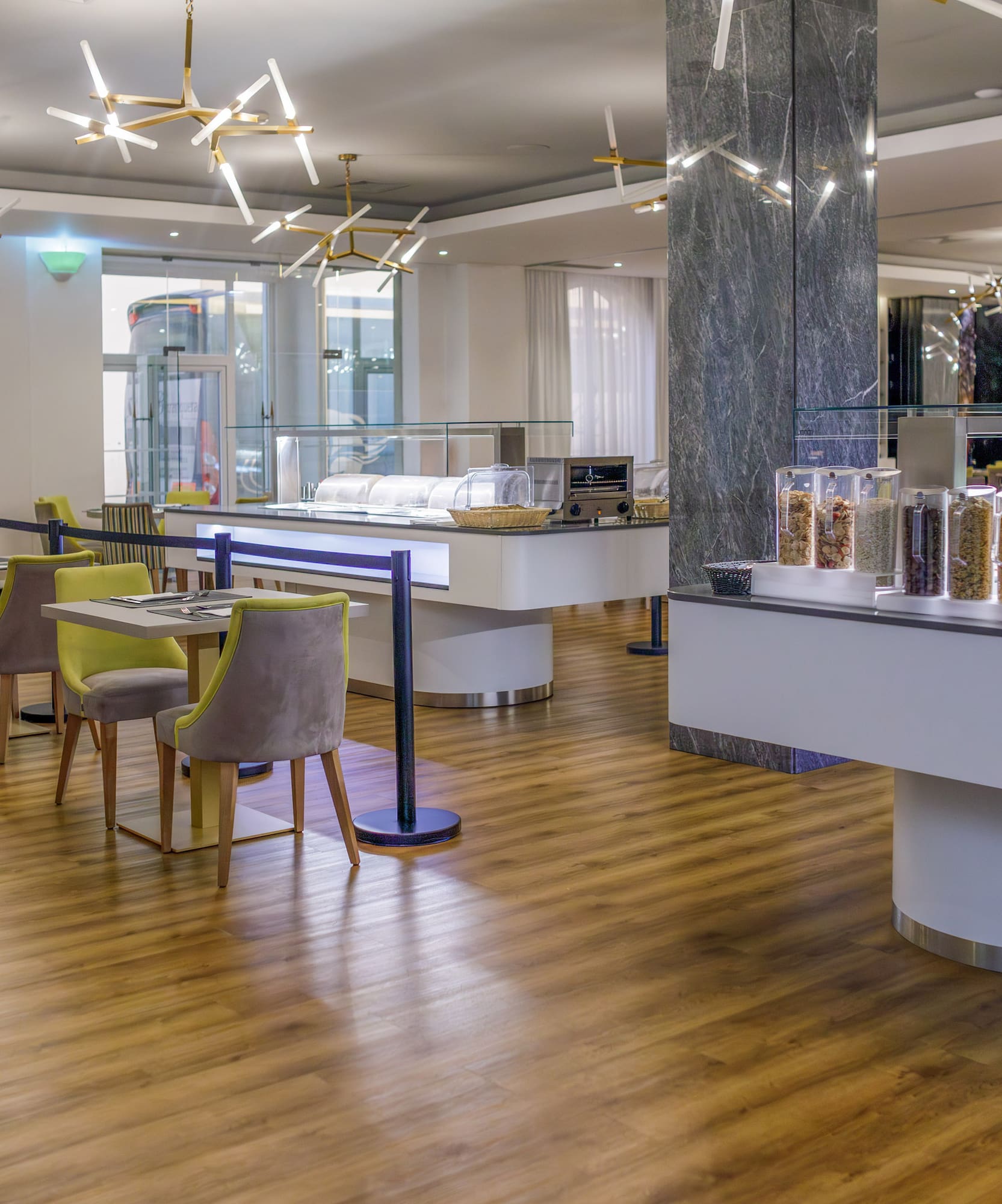 a restaurant with a buffet and chairs