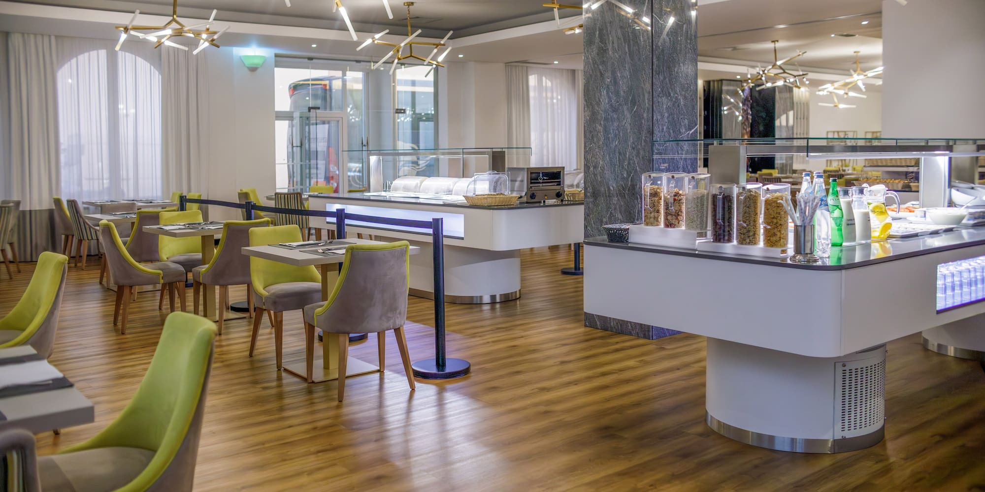 a restaurant with a buffet and chairs