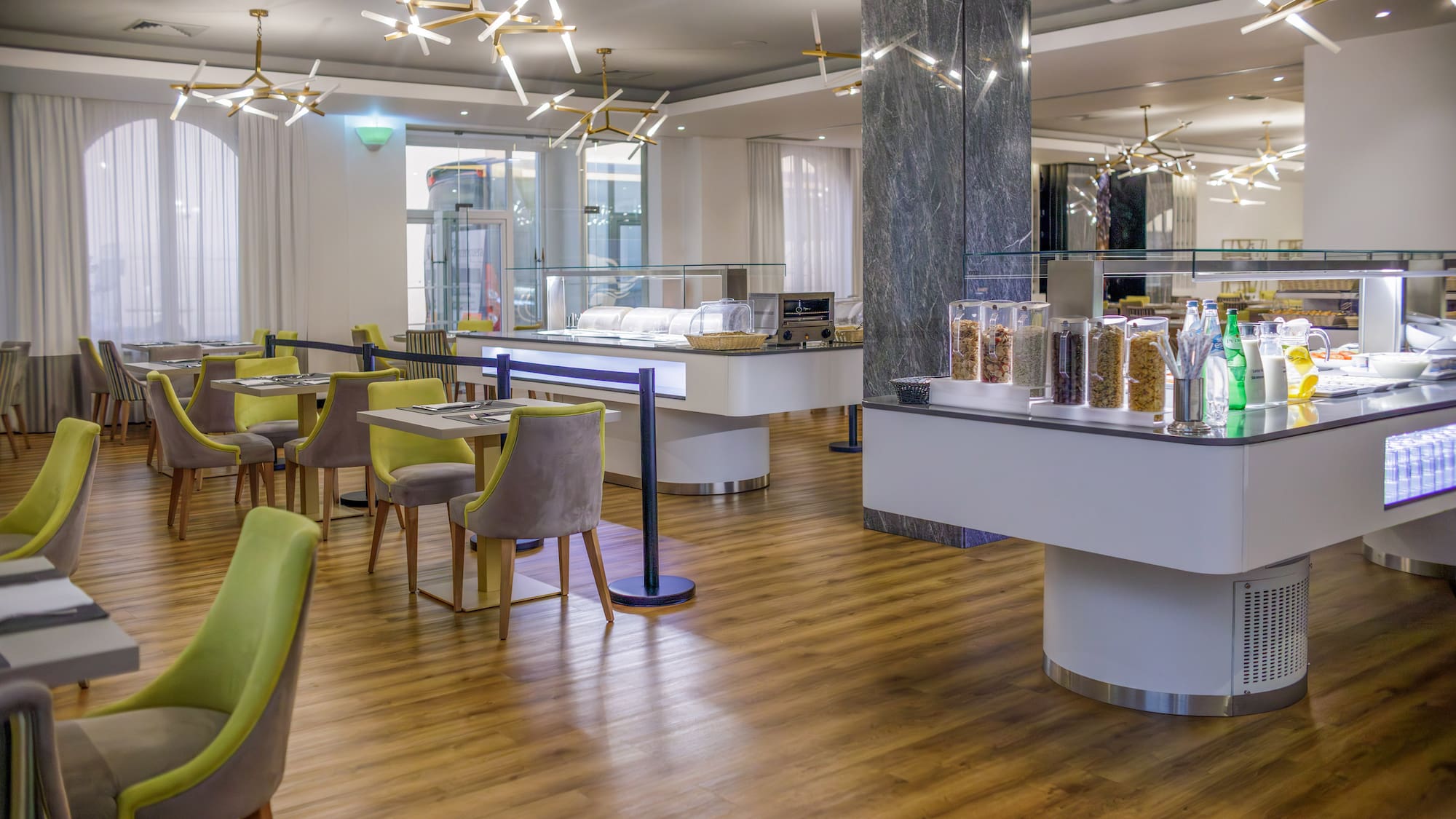 a restaurant with a buffet and chairs