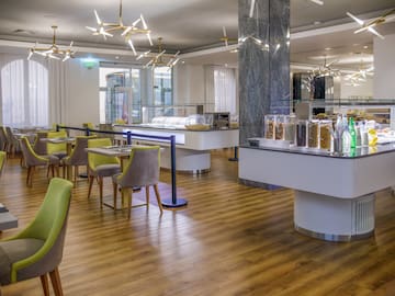 a restaurant with a buffet and chairs