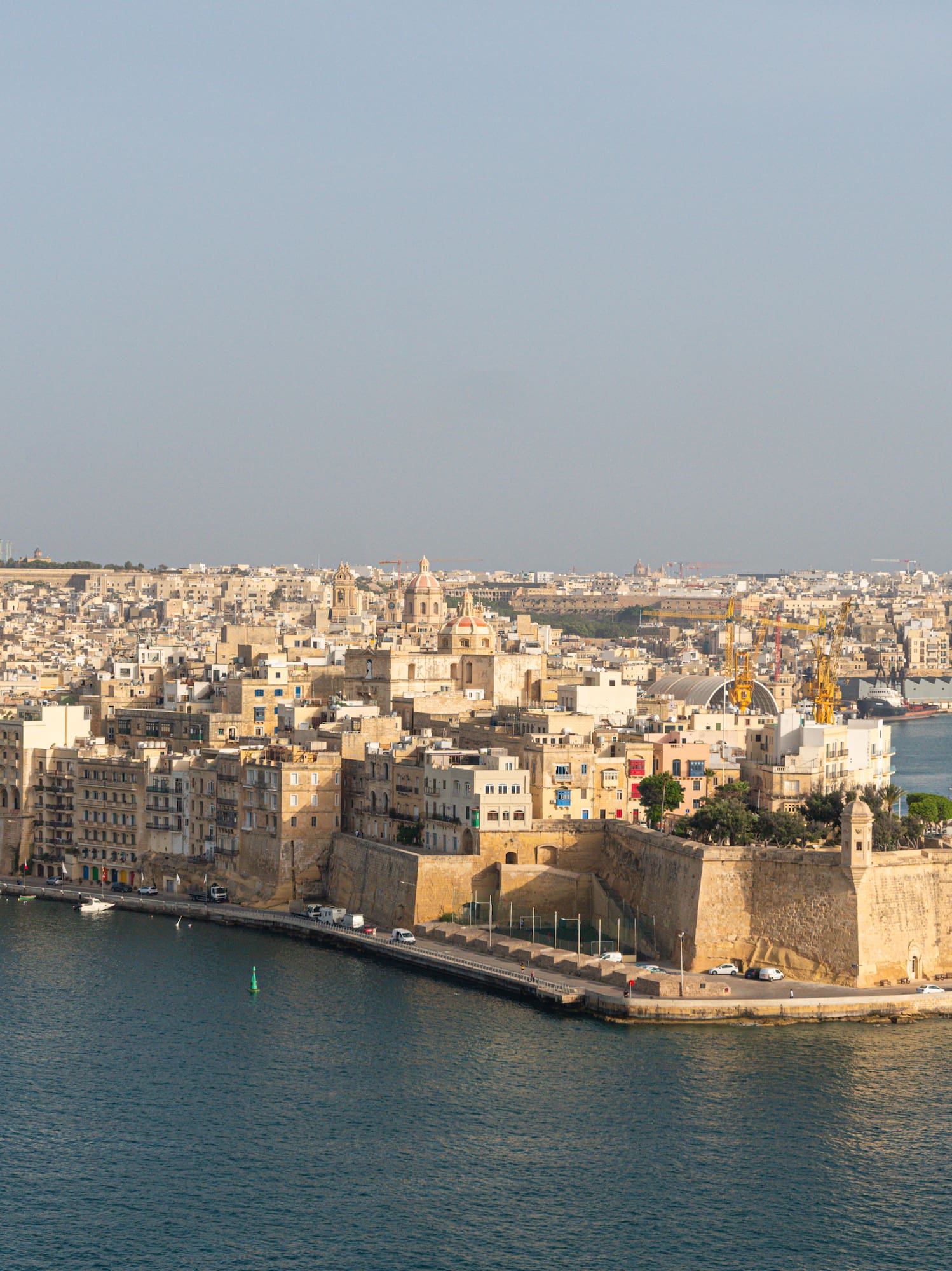 Fortified city of Birgu, Malta, on Grand Harbour with boats.