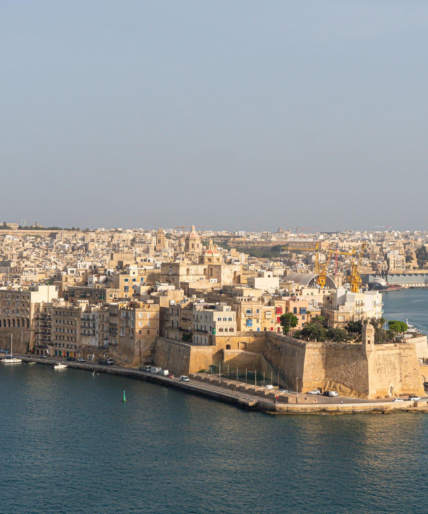 Fortified city of Birgu, Malta, on Grand Harbour with boats.