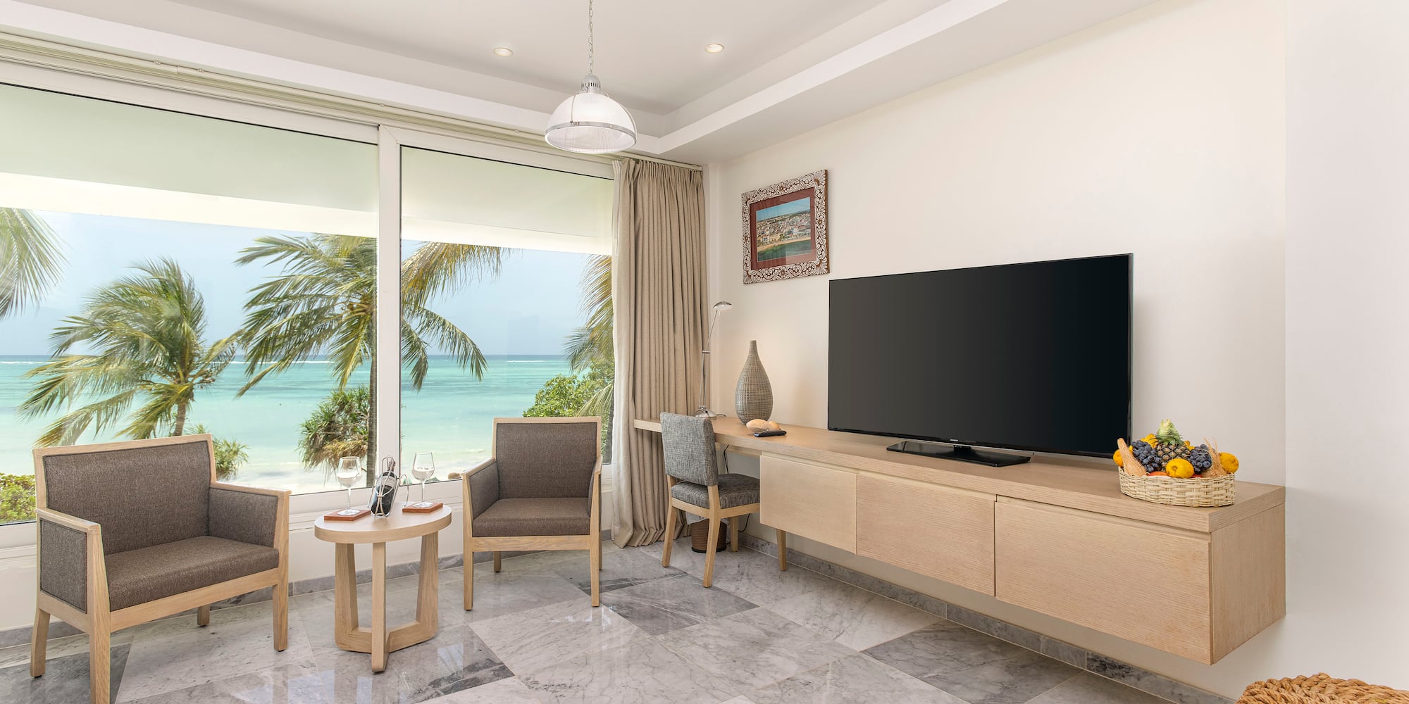 a room with a television and chairs