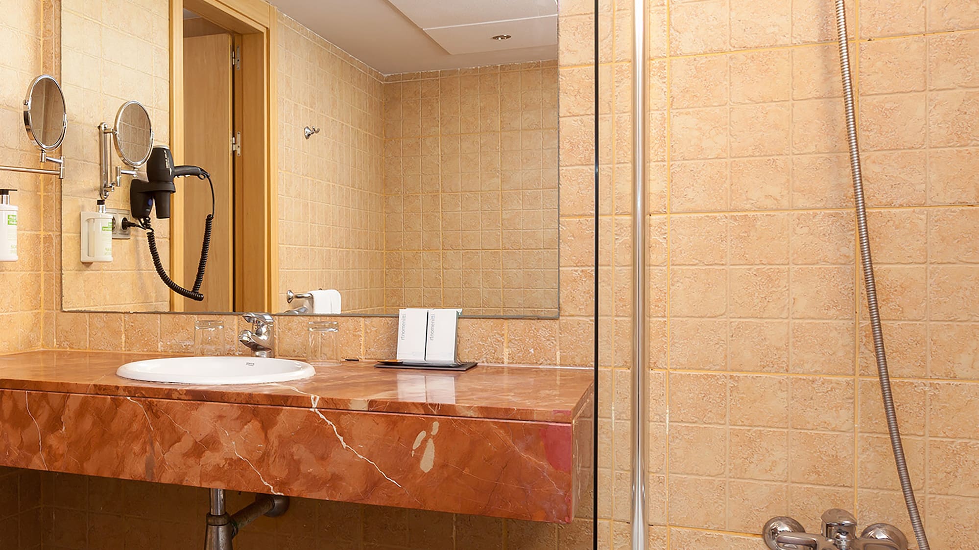 a bathroom with a sink and shower