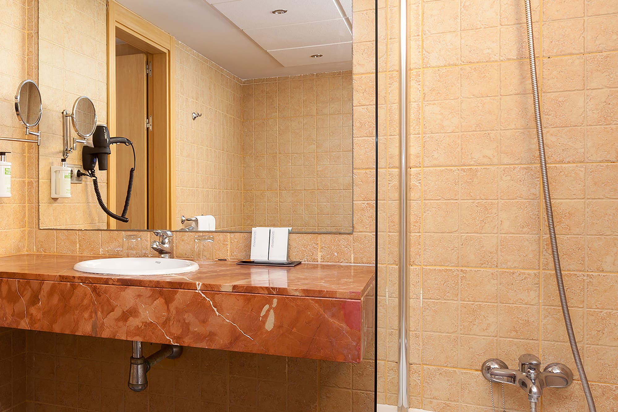 a bathroom with a sink and shower