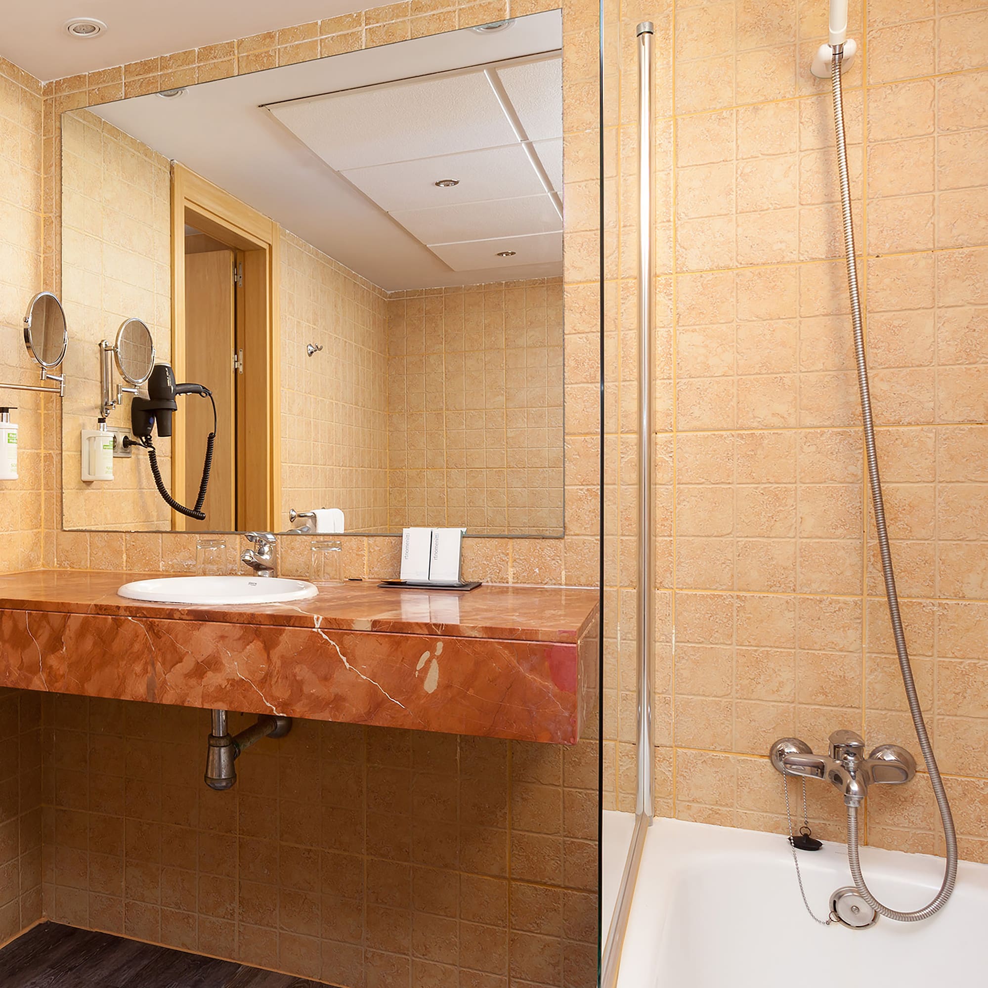 a bathroom with a sink and shower