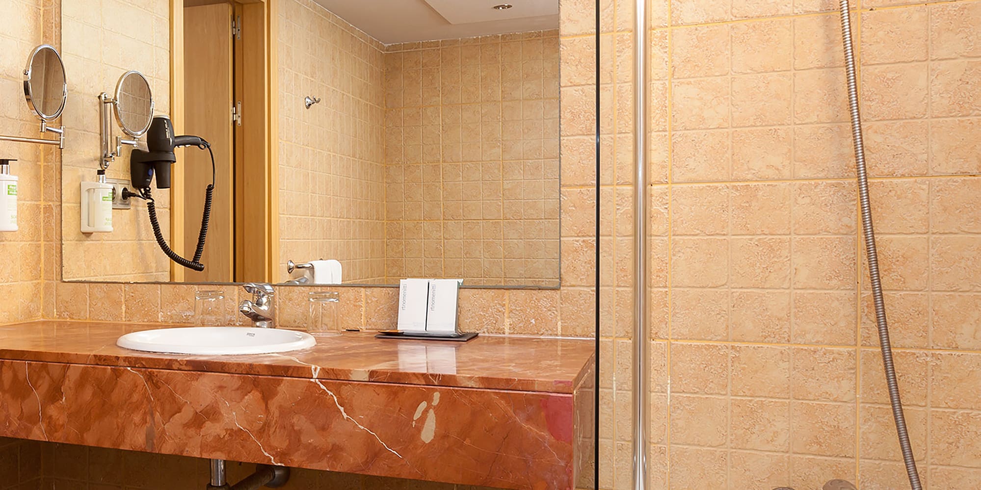 a bathroom with a sink and shower