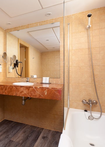 a bathroom with a sink and shower