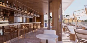 a restaurant with a bar and chairs