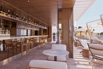 a restaurant with a bar and chairs