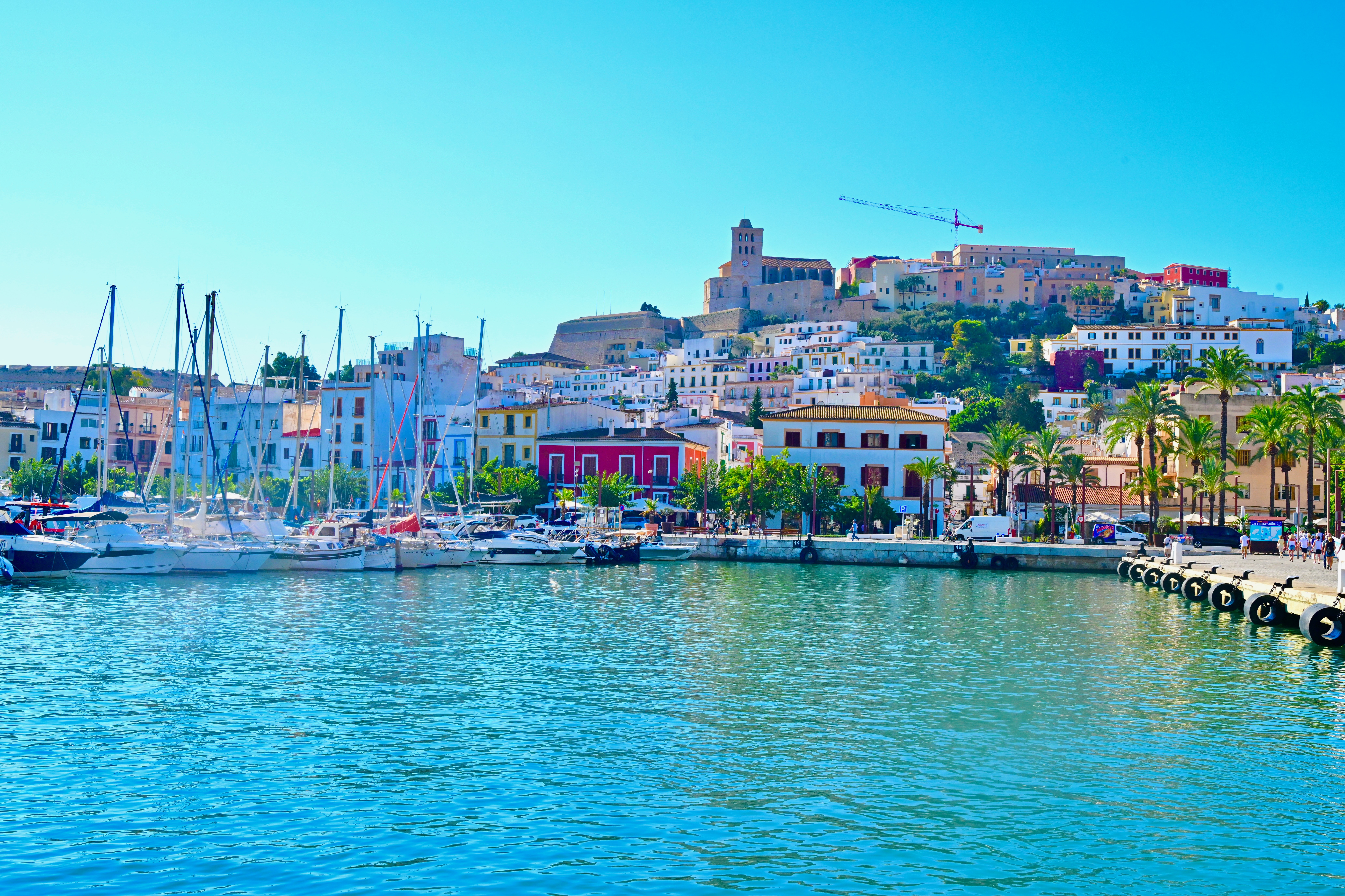 a body of water with boats and buildings on the side