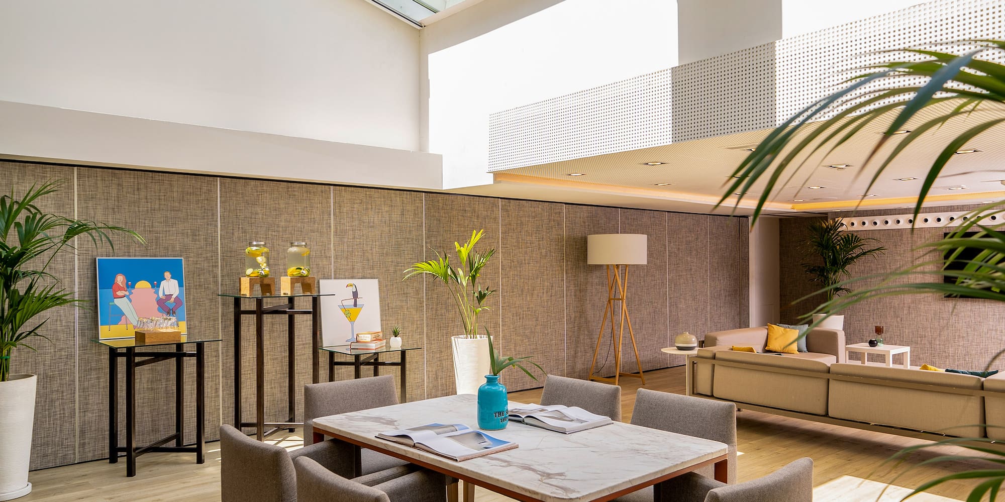 a room with a glass roof and a table and chairs