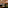 Upscale restaurant interior: green booths, golden chain ceiling, ambient lighting.