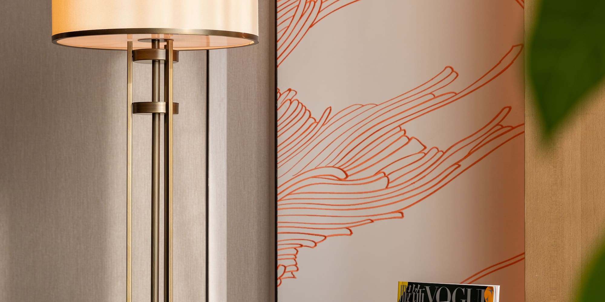 a lamp next to a magazine rack