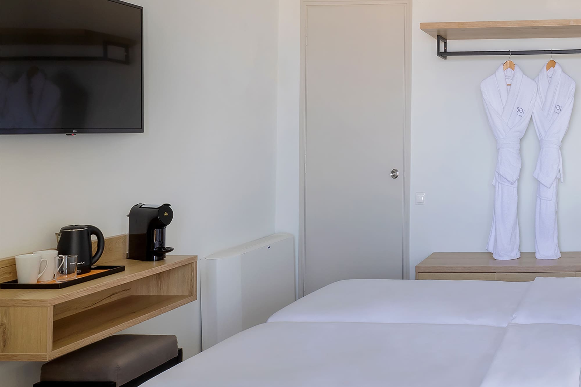 a room with a bed and a tv