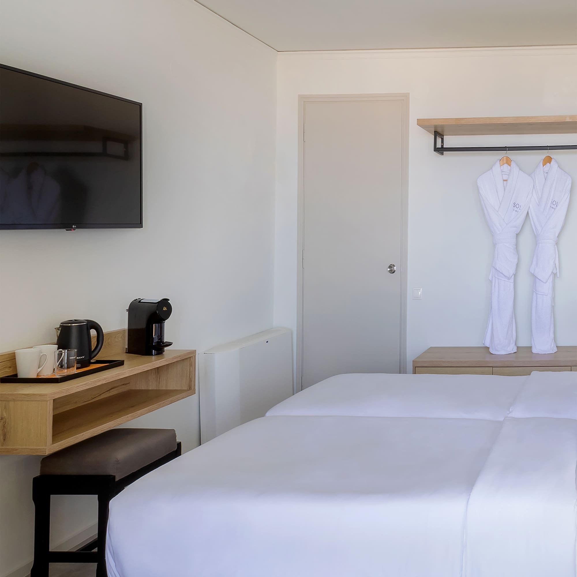 a room with a bed and a tv