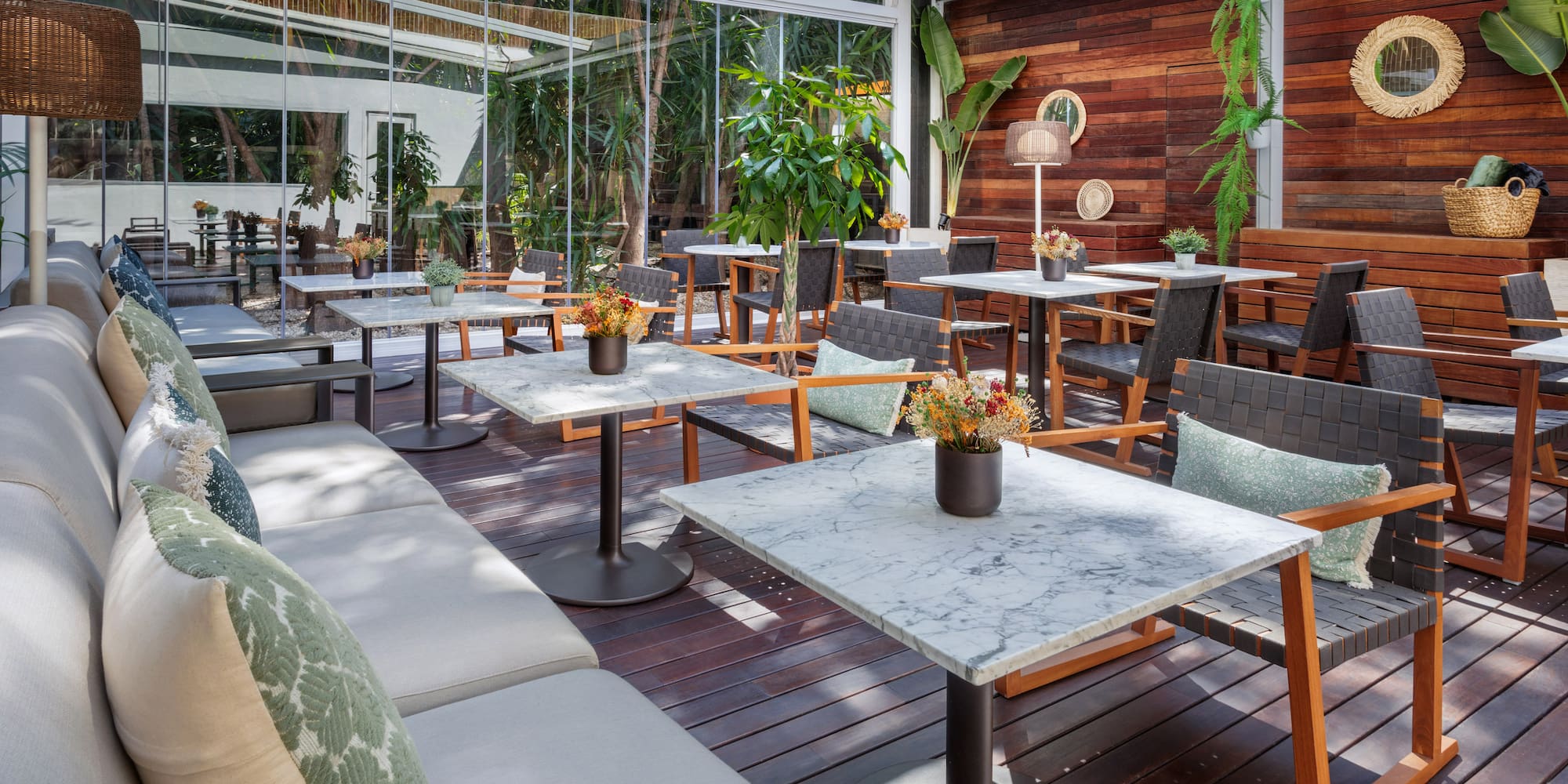 a patio with tables and chairs