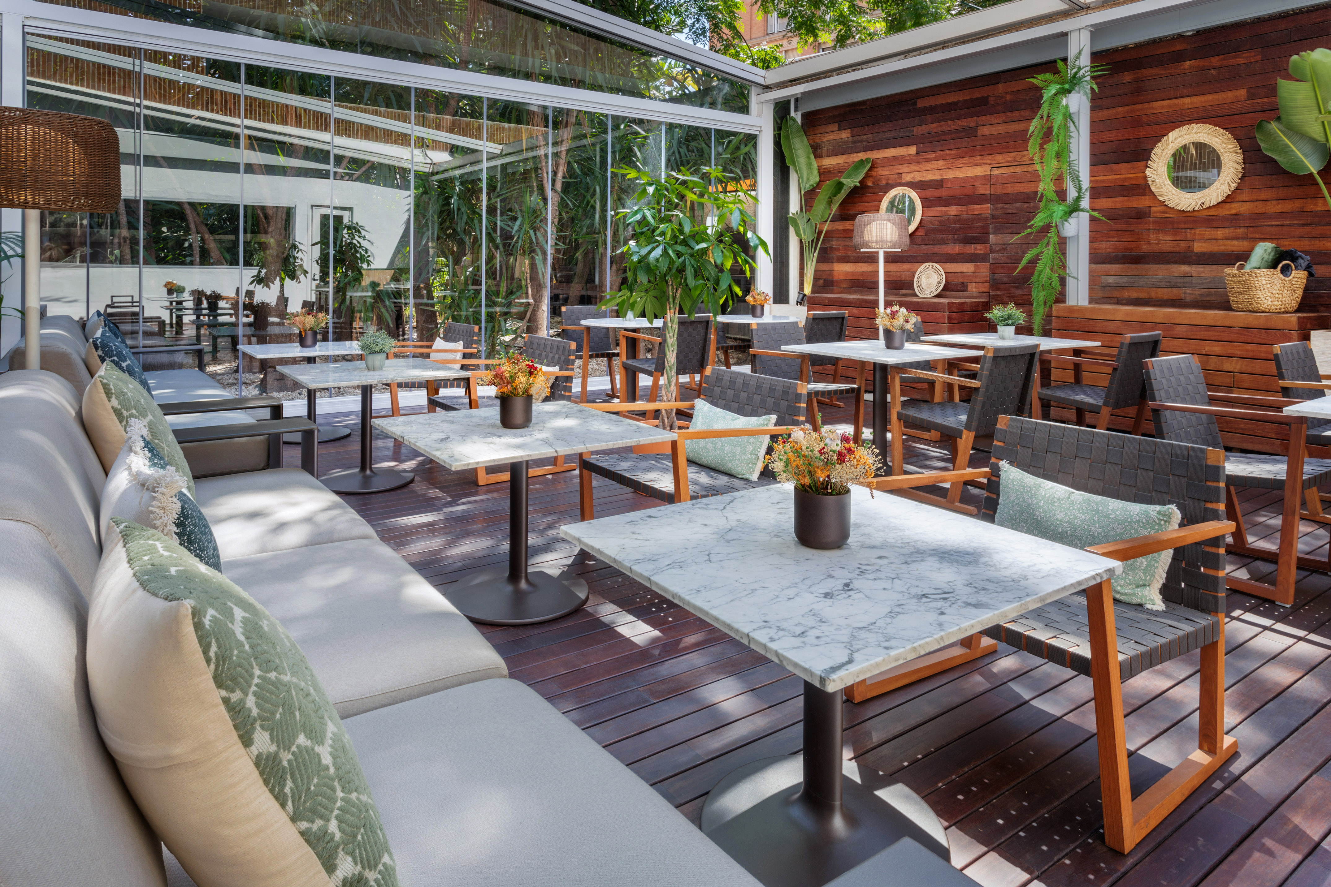 a patio with tables and chairs
