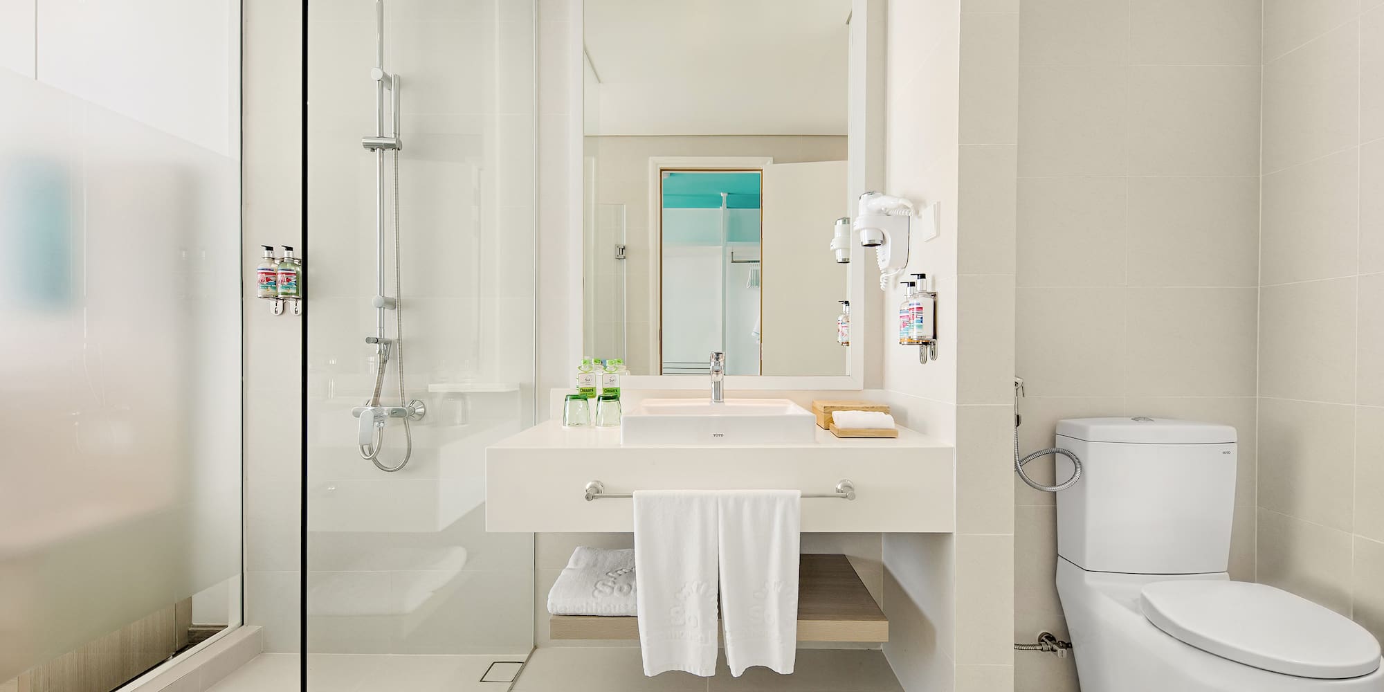 a bathroom with a shower and sink