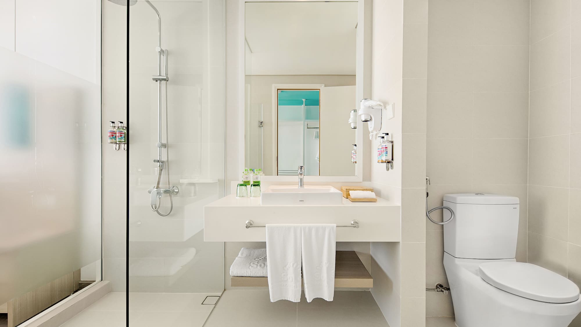 a bathroom with a shower and sink