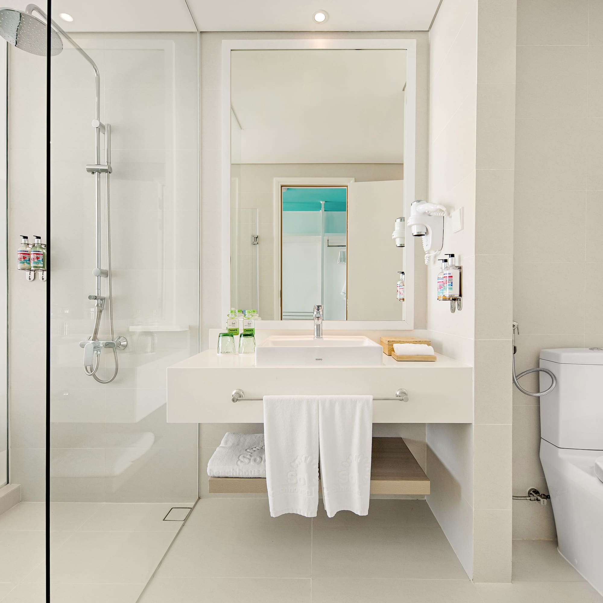 a bathroom with a shower and sink