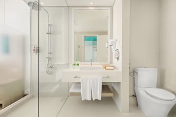 a bathroom with a shower and sink