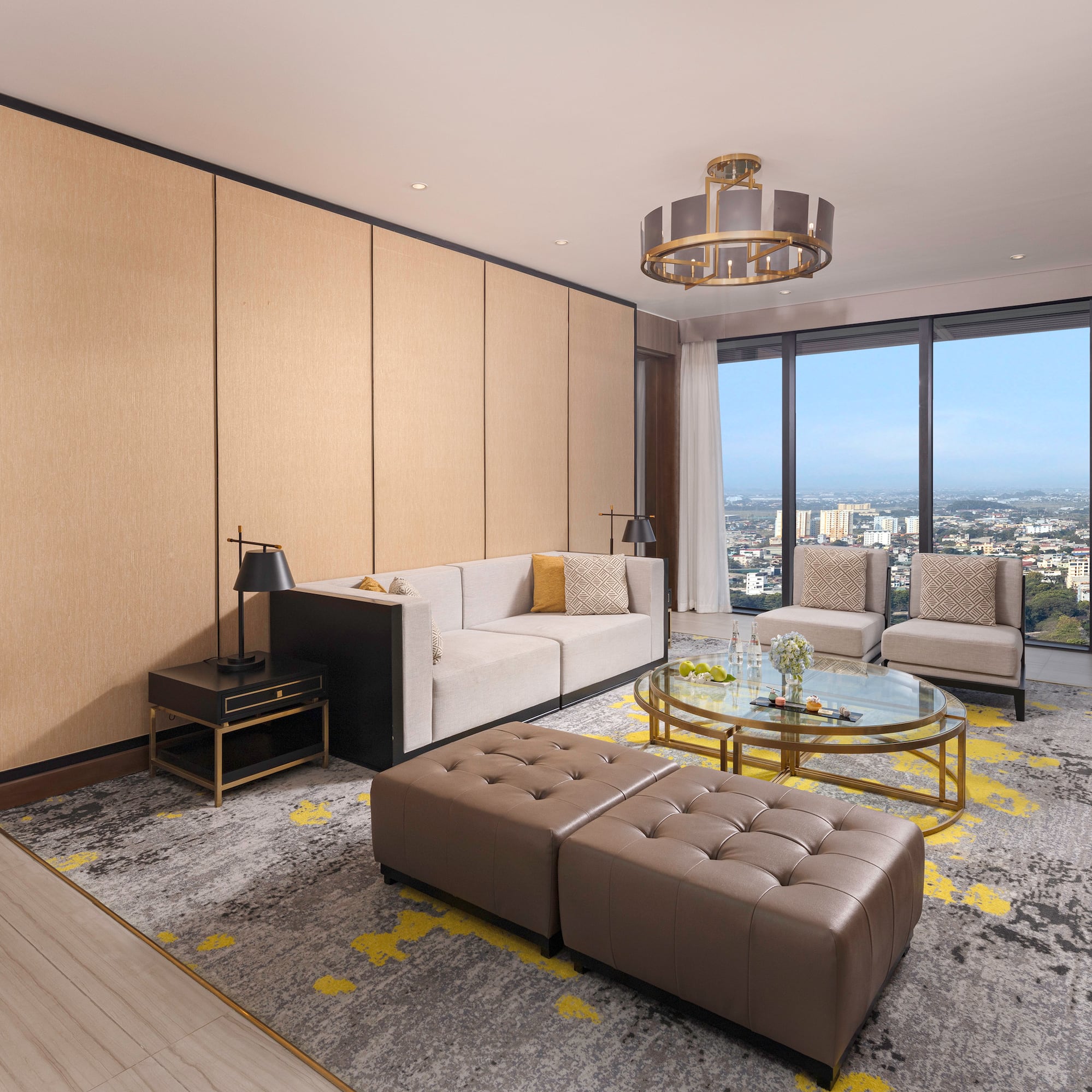 a living room with a large window and a city view